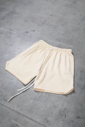 CREME TRIANGLE SHORTS